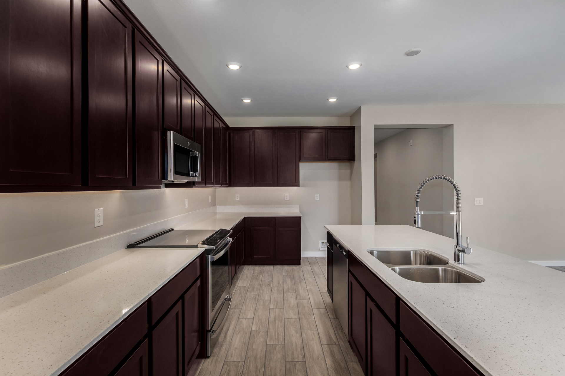 The Poppy floorplan featuring an upgraded induction range at the kitchen.