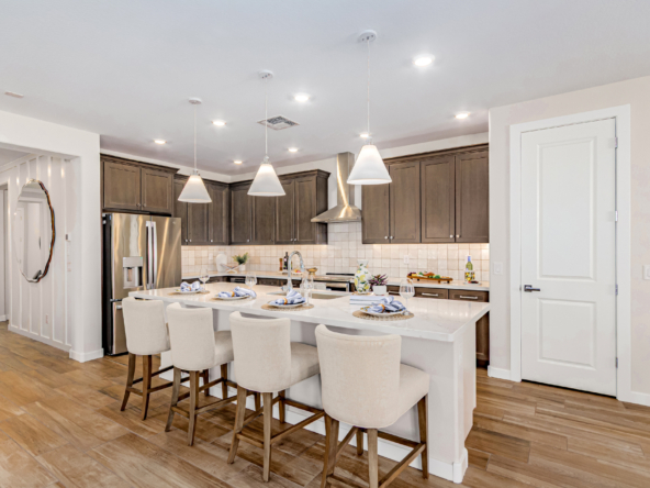 Poppy Model Home Kitchen with soft brown cabinets and bright lighting