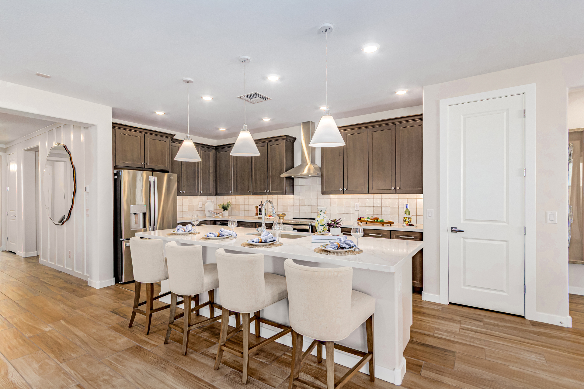 Poppy Model Home Kitchen with soft brown cabinets and bright lighting