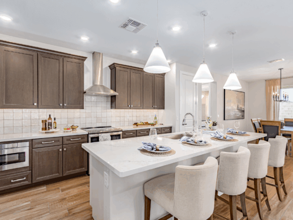 Poppy Model Home Kitchen featuring a large island and upgraded appliances