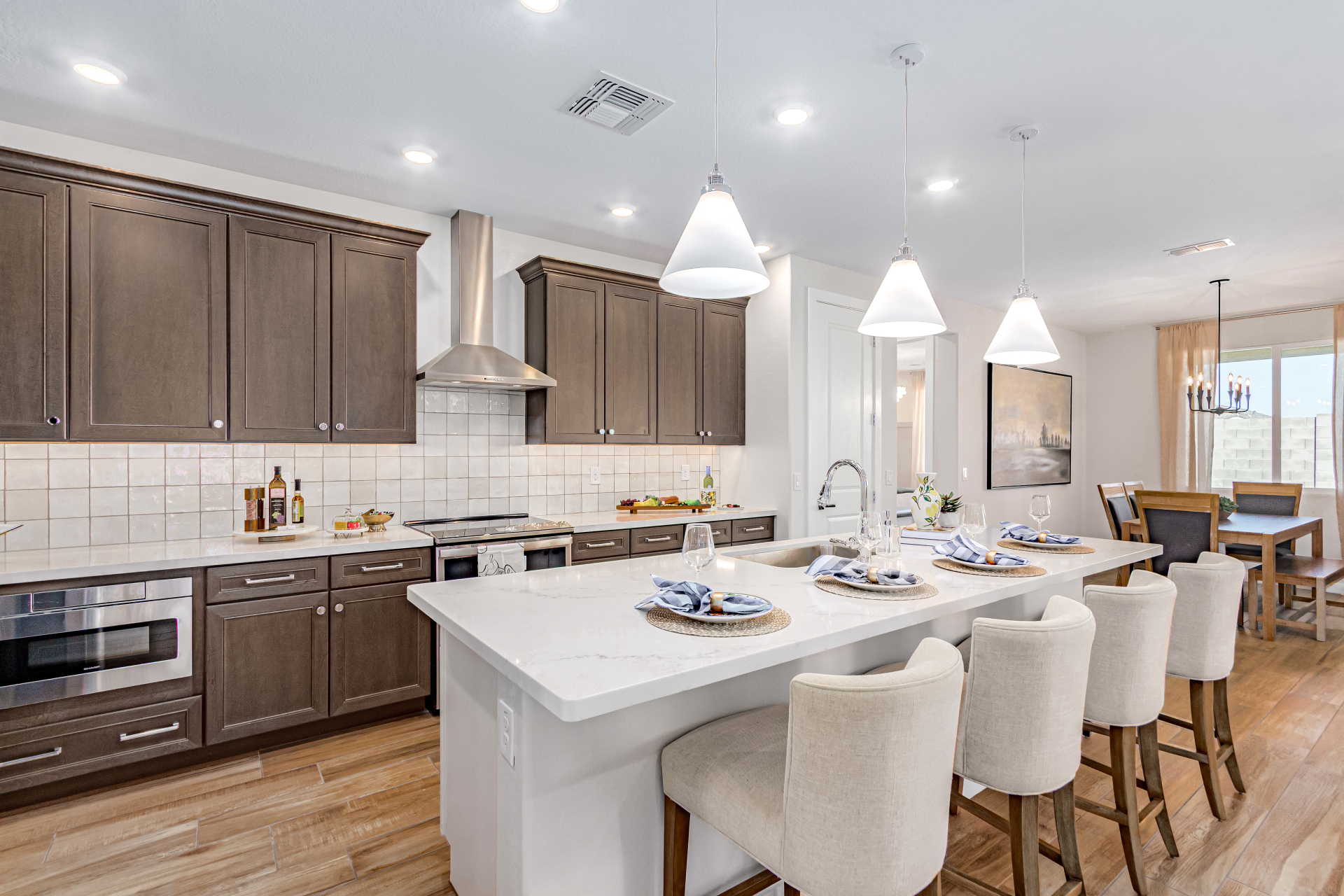 Poppy Model Home Kitchen featuring a large island and upgraded appliances