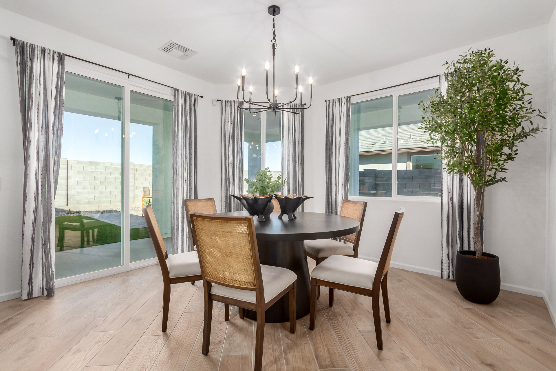 Journey model home breakfast nook featuring a round 6-person table