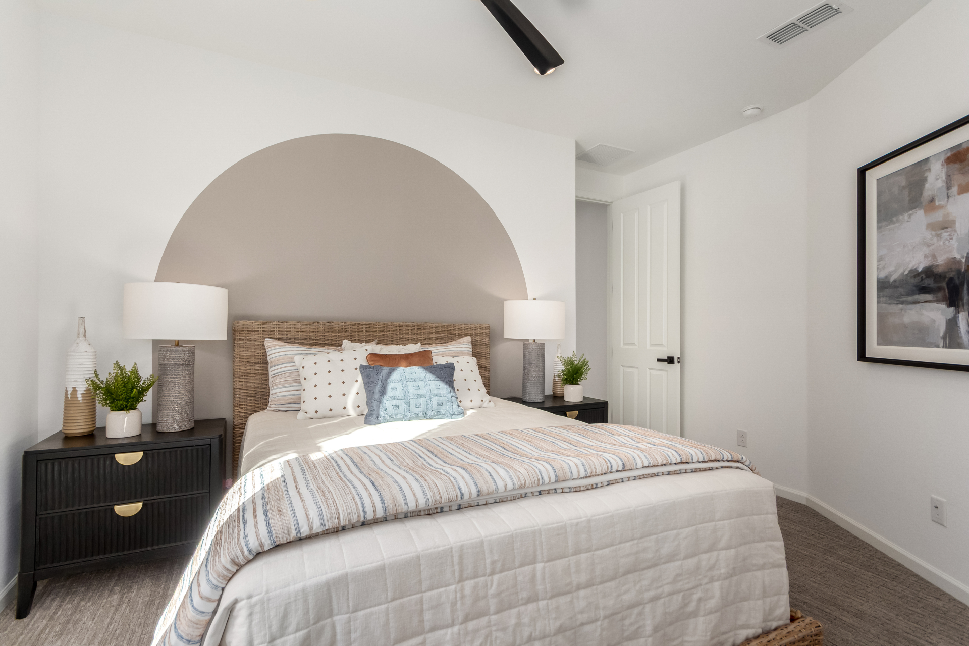 Journey model home 2nd bedroom with a large bed