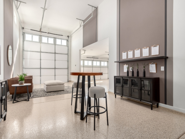 Journey model home's RV garage decorated as a "man cave" and you can see the attached 2 car garage