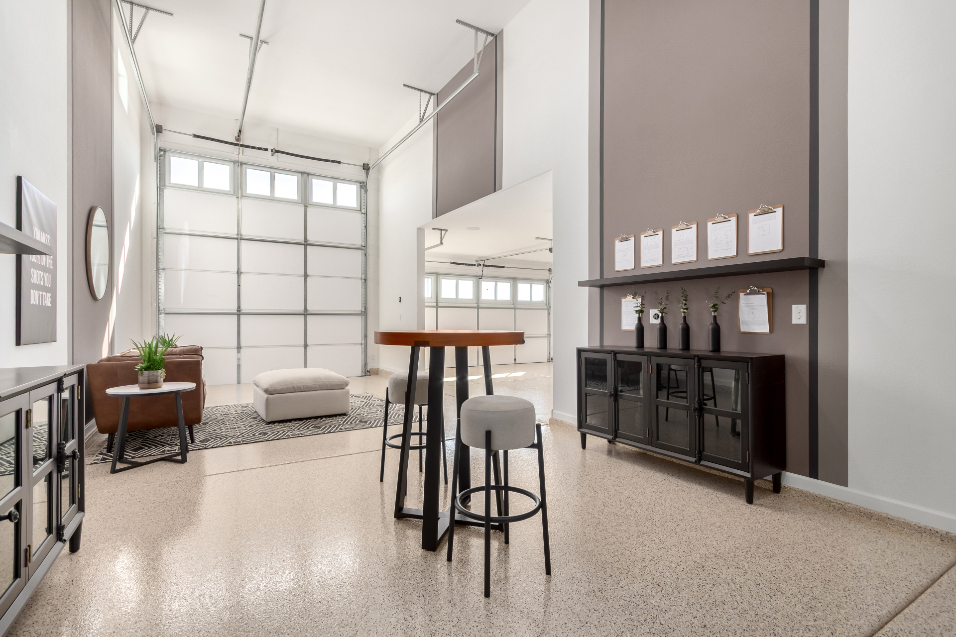 Journey model home's RV garage decorated as a "man cave" and you can see the attached 2 car garage