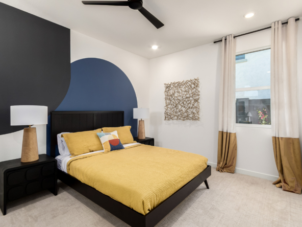 Marigold model home secondary bedroom showing a queen bed