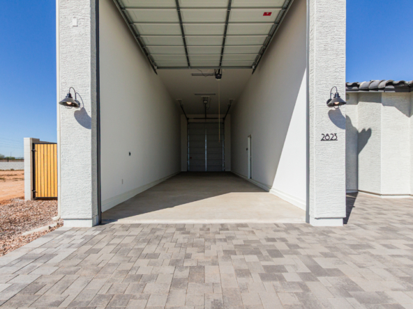 Discovery RV home viewing into the large RV garage from the driveway