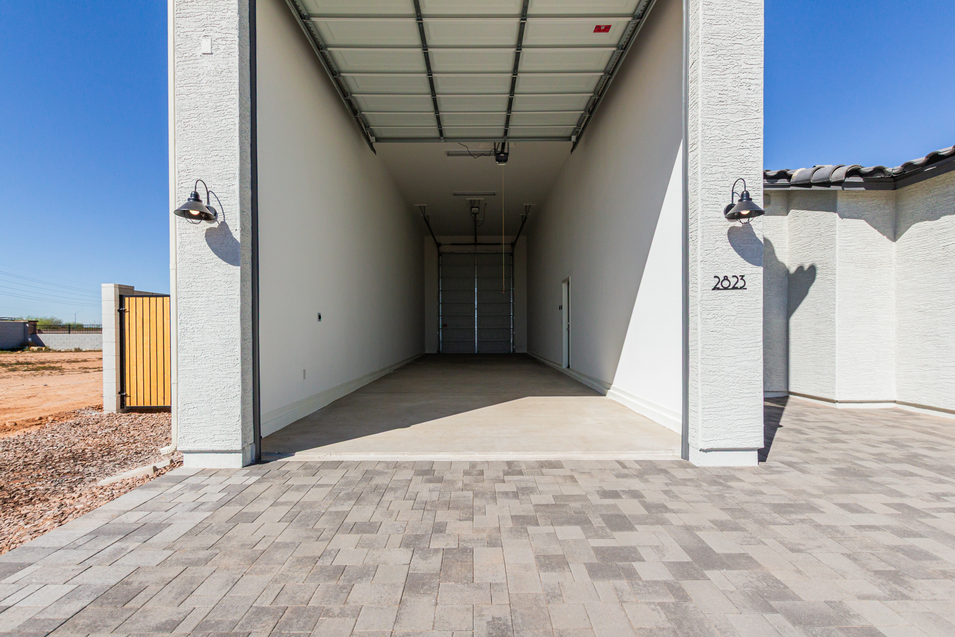 Discovery RV home viewing into the large RV garage from the driveway