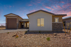 Tranquility RV floor plan as seen from the street with a twilight sunset behind it