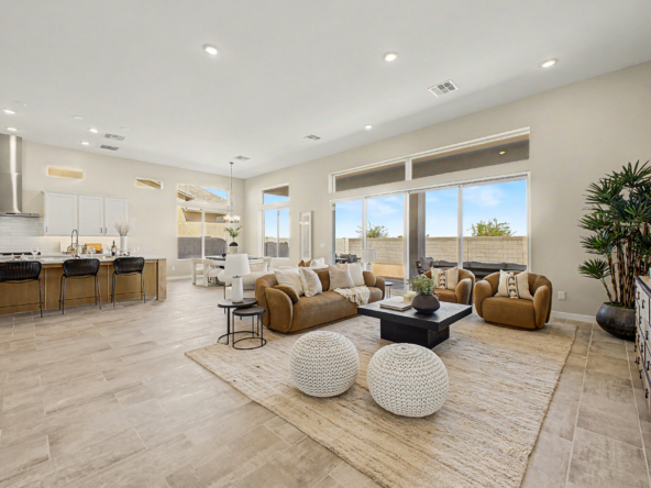 Lavish Floor Plan great room showcasing oversized glass sliding doors and windows