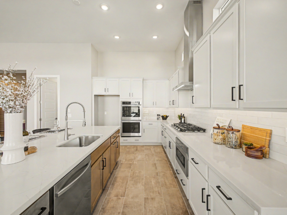Lavish Floor Plan kitchen showing gas cooktop and undermount sink