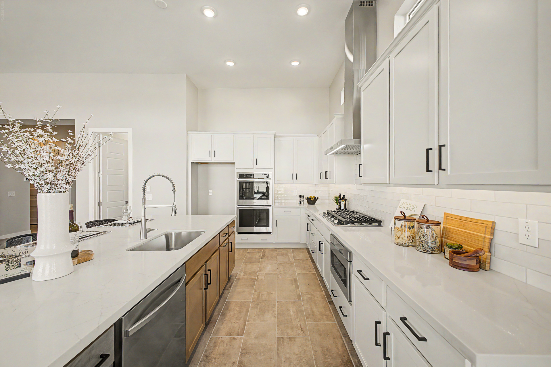Lavish Floor Plan kitchen showing gas cooktop and undermount sink