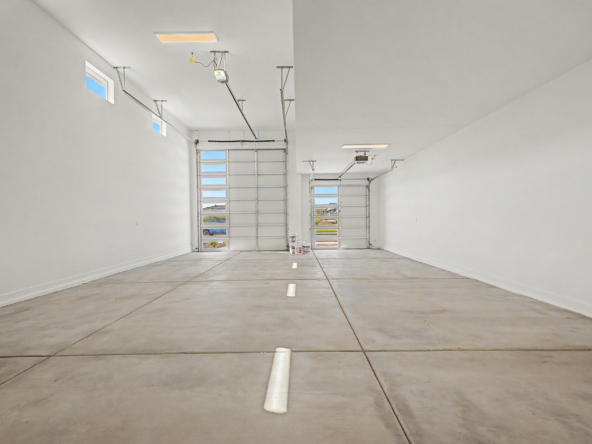 Lavish Floor Plan garage with soaring ceiling heights and room for an RV