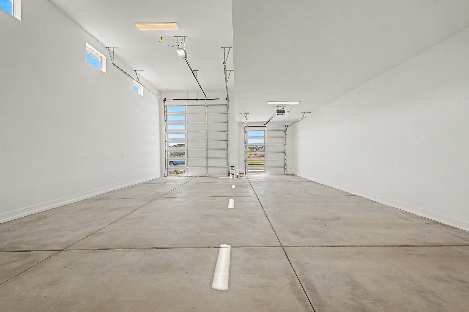 Lavish Floor Plan garage with soaring ceiling heights and room for an RV