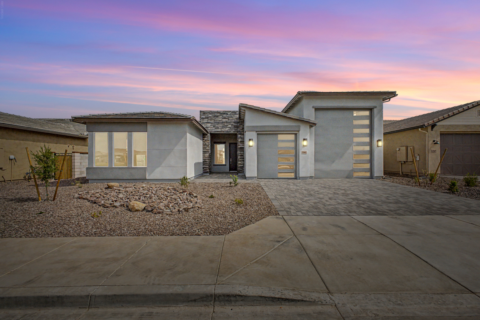 Lavish Floor Plan as seen from the street with a twilight skyline