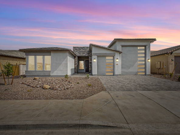 Lavish Floor Plan as seen from the street with a twilight skyline