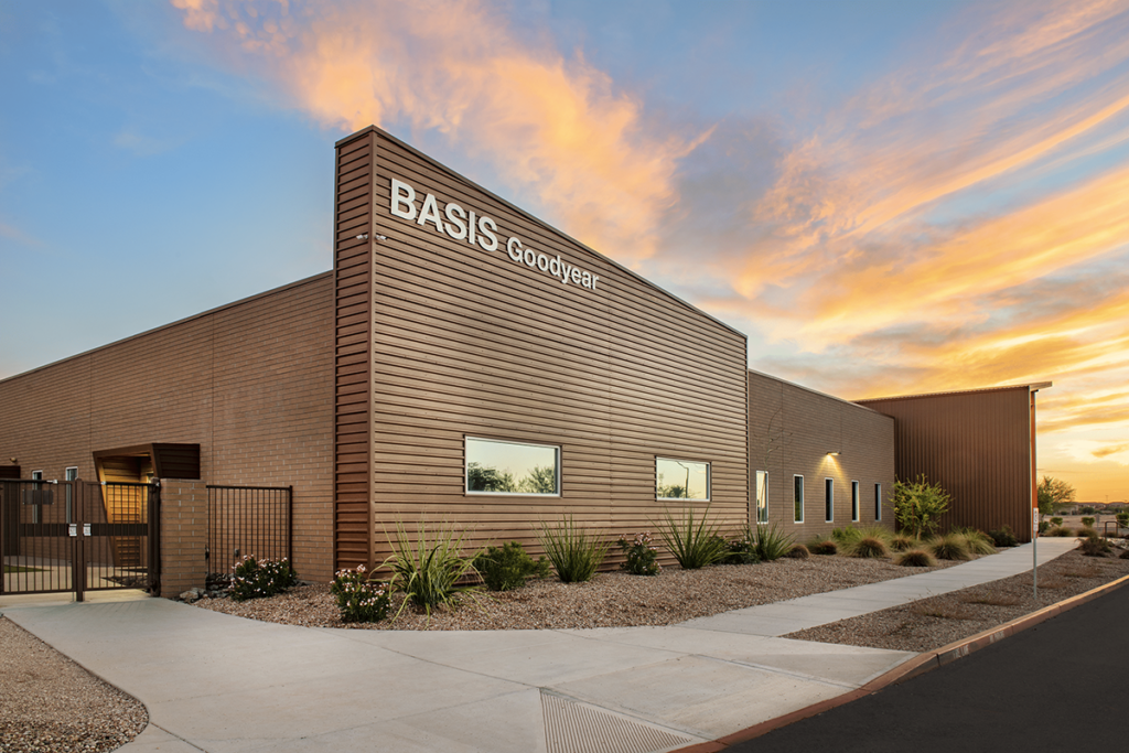 View of BASIS Goodyear school with a sunset behind it