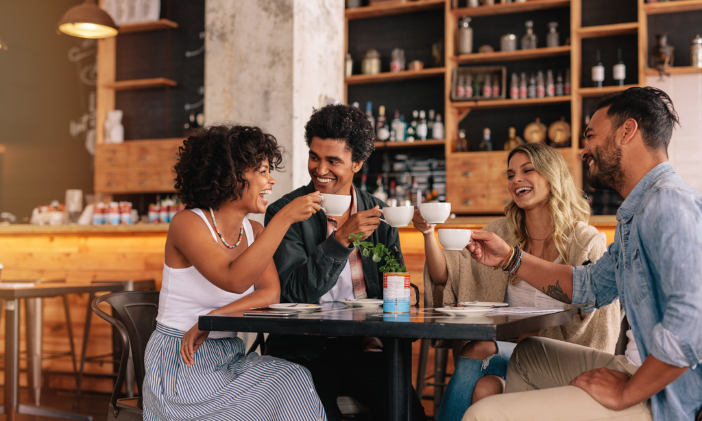 Friends enjoying coffee at a local coffee shop